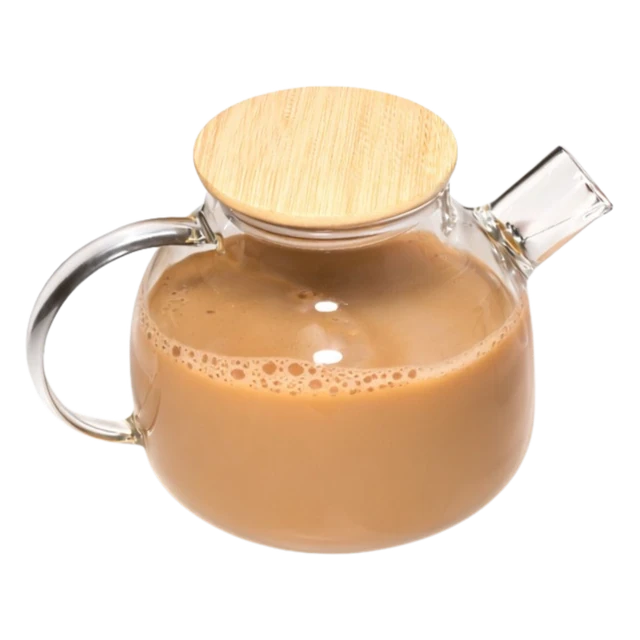 A glass tea pot of milky karak chai