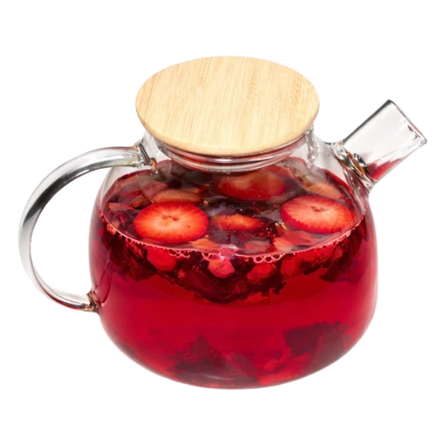 A glass tea pot of deep red mixed berry and hibiscus infusion